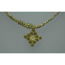 Gold necklace with a diamond shape cross pendant